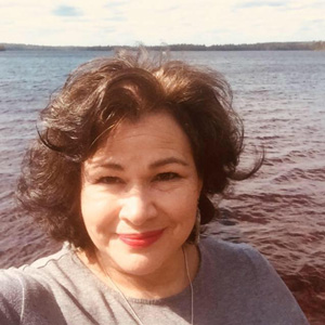 Angeline Boulley by lake in summer